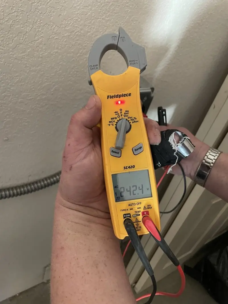 Voltage testing with clamp meter during Recessed Lighting Installation in Muhlenberg
